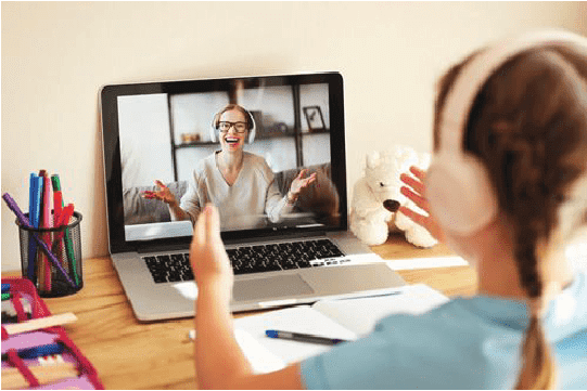 Online tutoring for children with live video class, student using laptop and headphones in a home learning environment