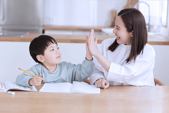 Teacher and student celebrating success during online tutoring session
